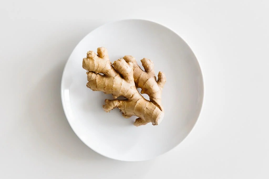 Plate of ginger on a white table.