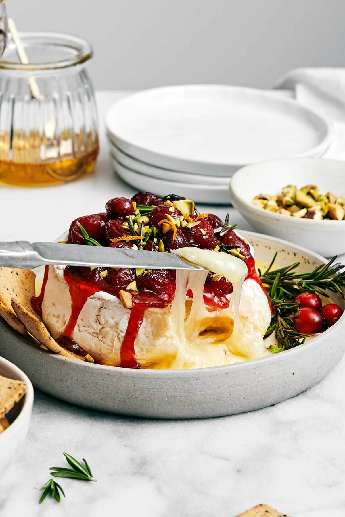 Melty baked brie with cranberry sauce.