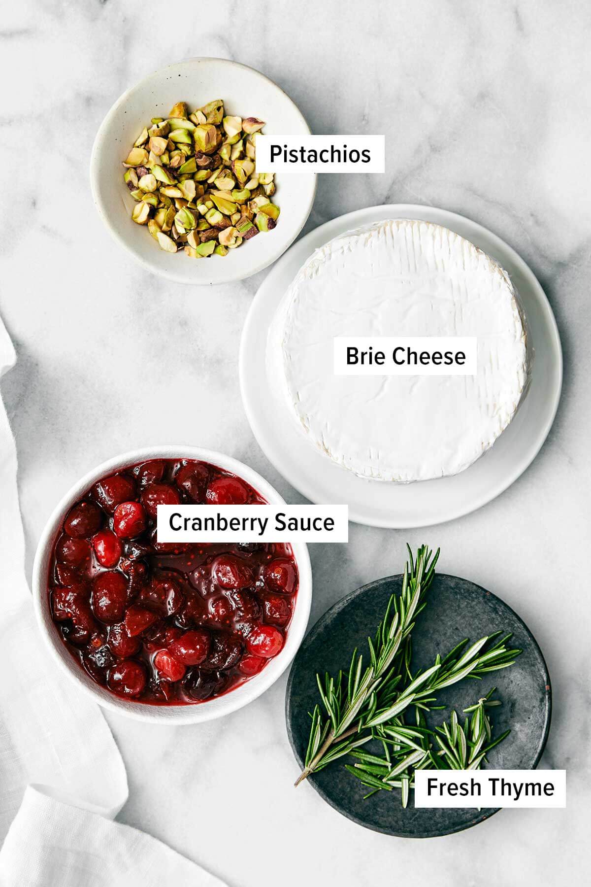 Ingredients for baked brie with cranberry sauce.