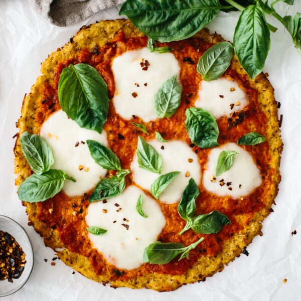 Cauliflower pizza crust with margherita toppings.