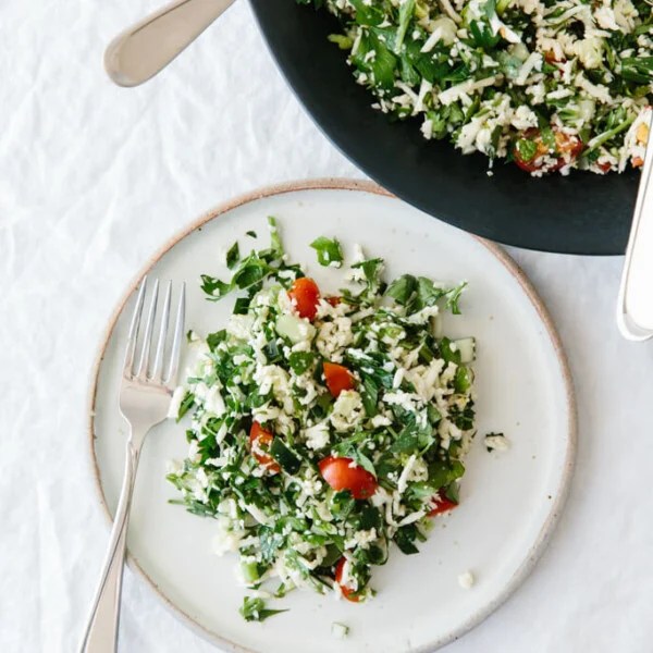 (gluten-free, paleo, whole30) Cauliflower rice tabbouleh is a tasty spin on tabbouleh and swaps bulgur with cauliflower rice, making this lemon herb salad gluten-free and paleo-friendly.