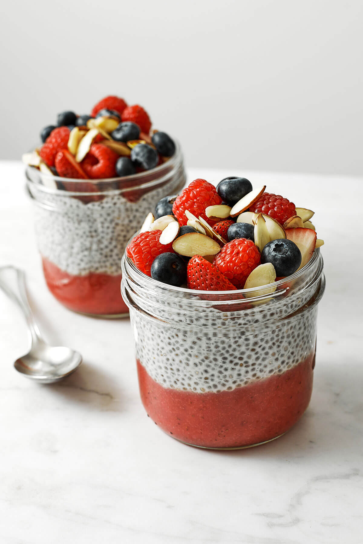 Two jars of chia pudding and fruits