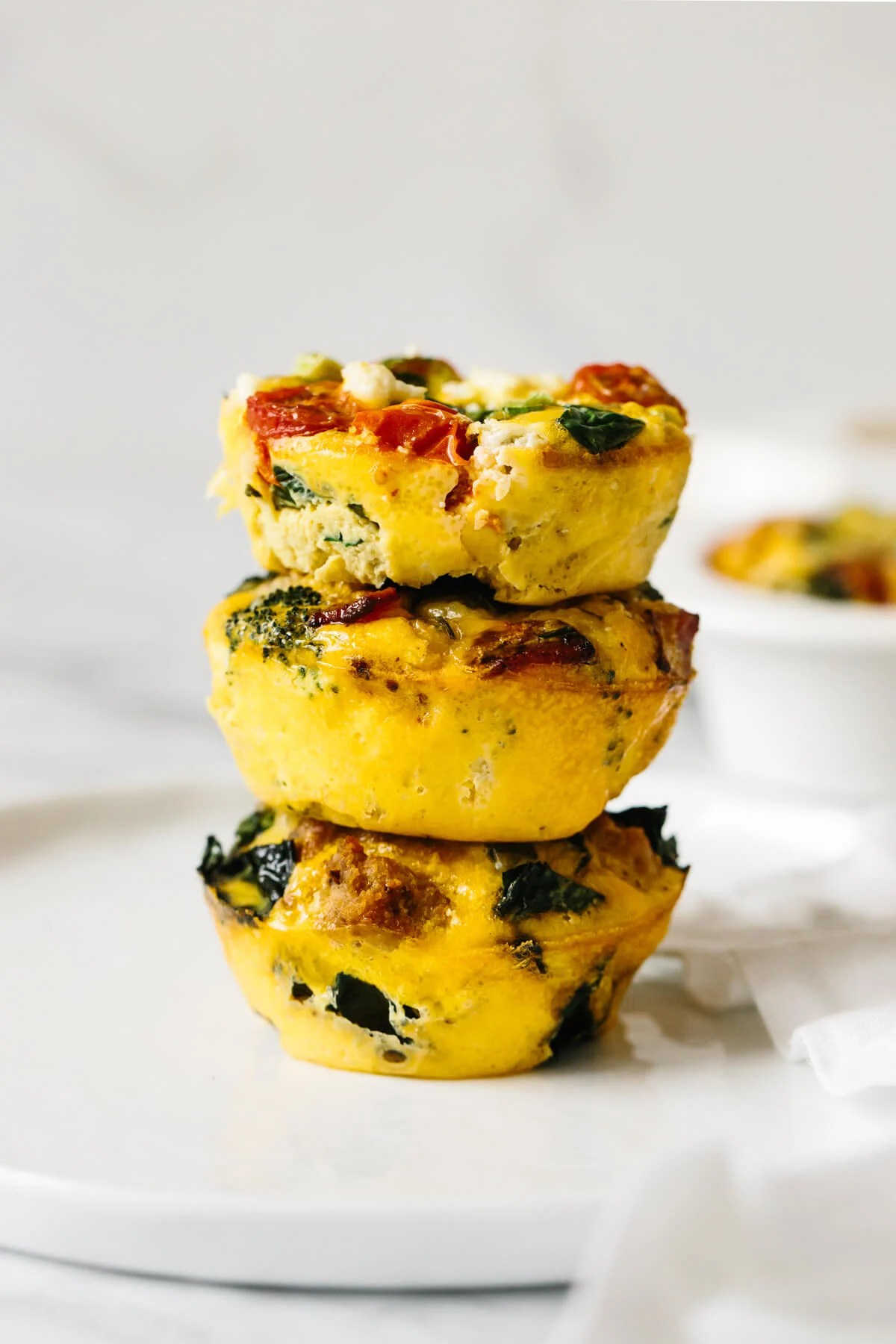 Three egg muffins stacked on top of each other.