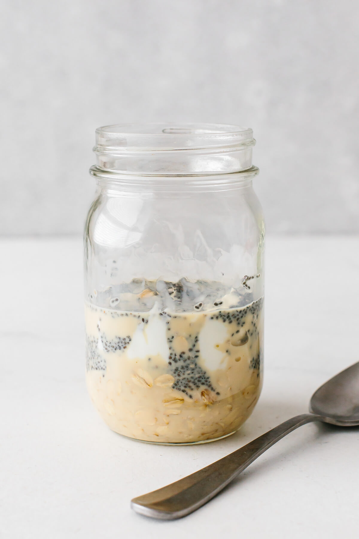 Mixing overnight oats in a jar.