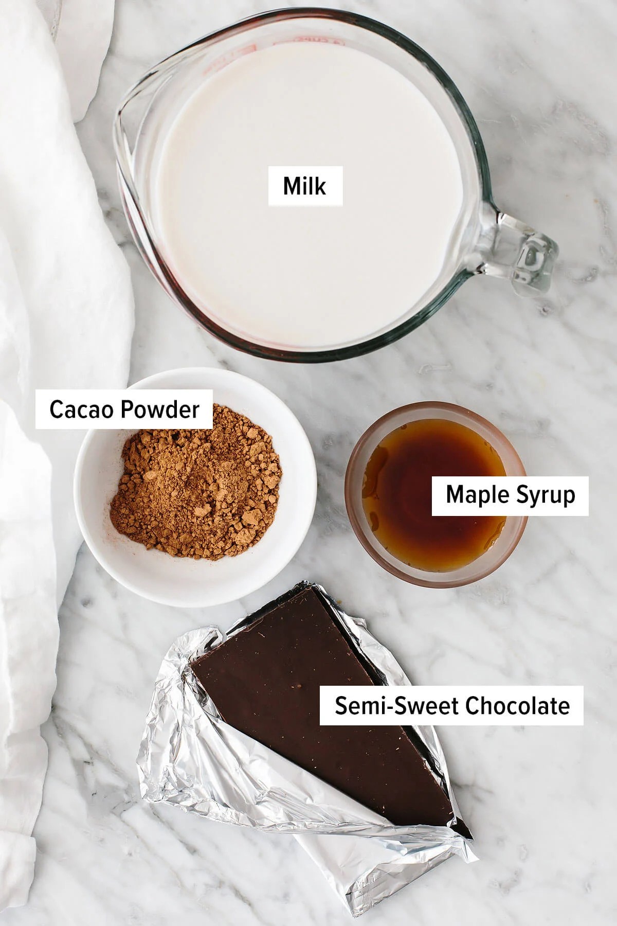 Ingredients for hot chocolate on a table.