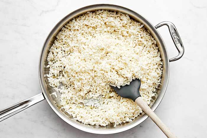 A pan with cooked cauliflower rice.