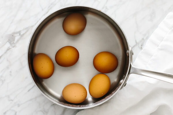 Eggs in a pot of water to boil.