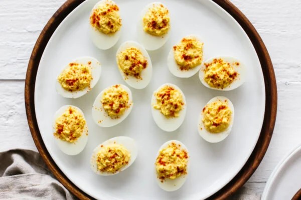 Deviled eggs on a serving plate.