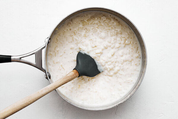 Stirring rice pudding in a pot