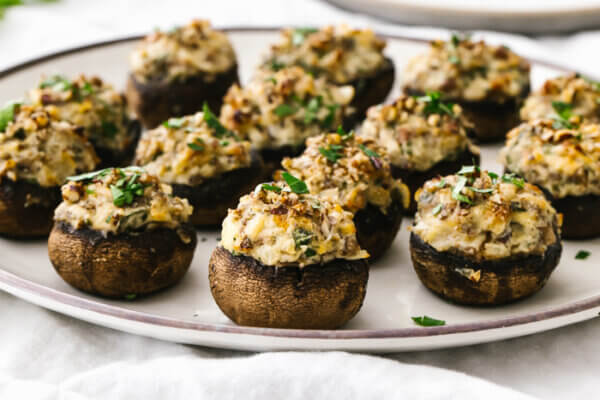 A plate filled with stuffed mushrooms.