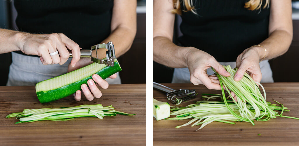 Making zucchini noodles with a julienne peeler.