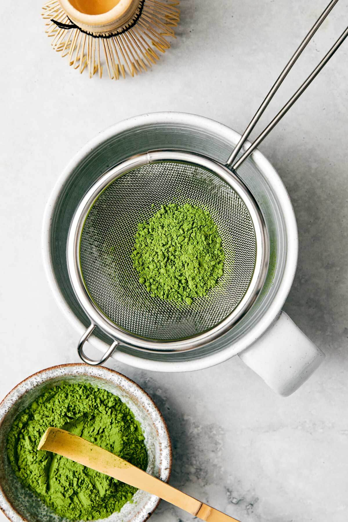 Sifting matcha in a sieve.