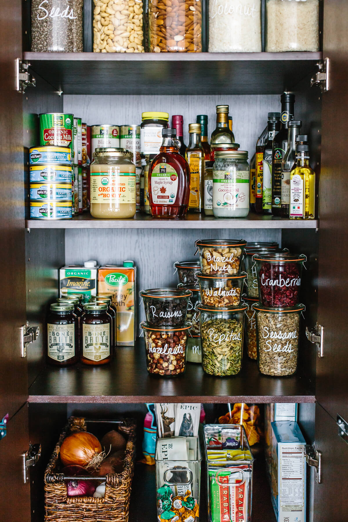 Jars and cans in a pantry.