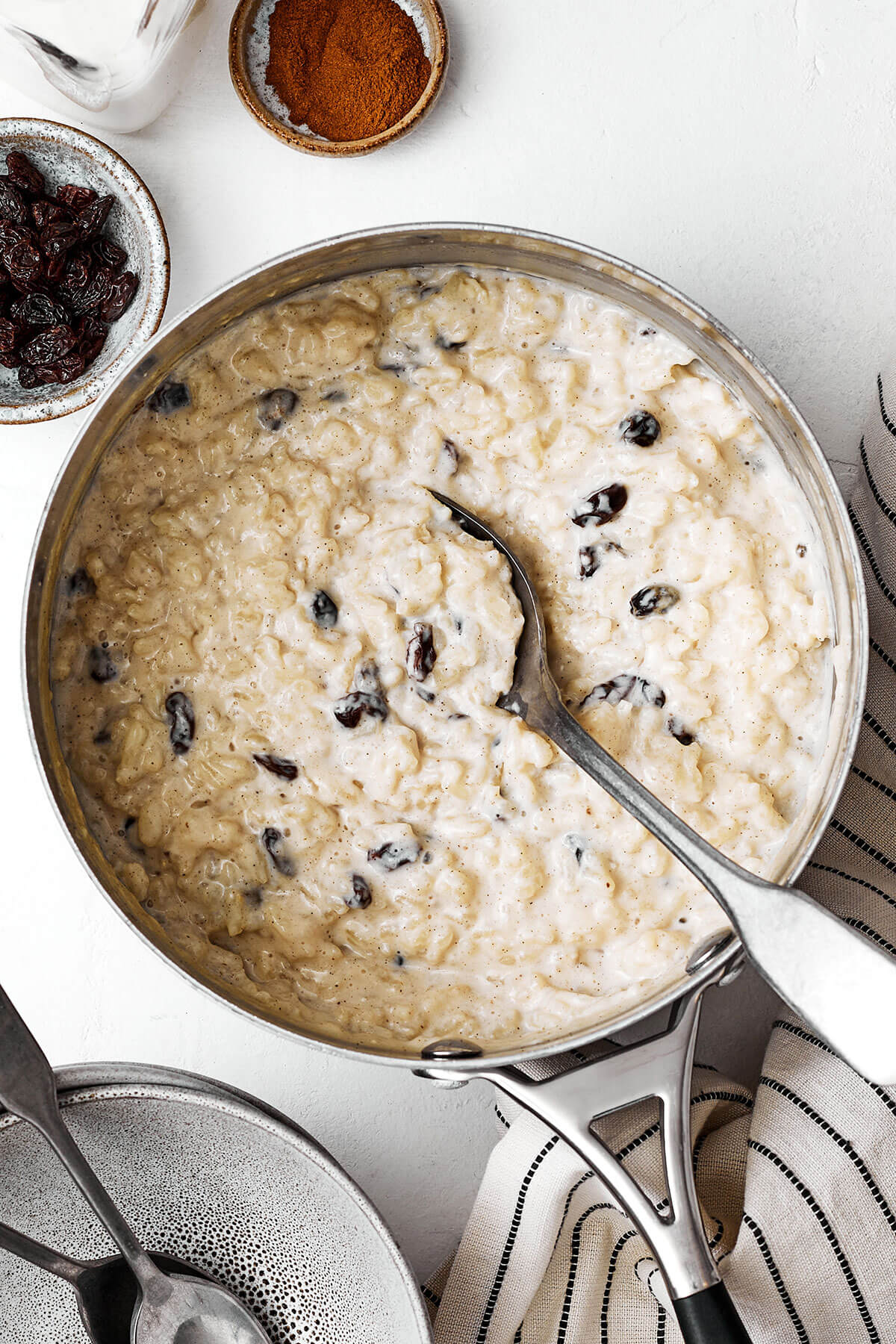 Cooked rice pudding in a pot with raisins