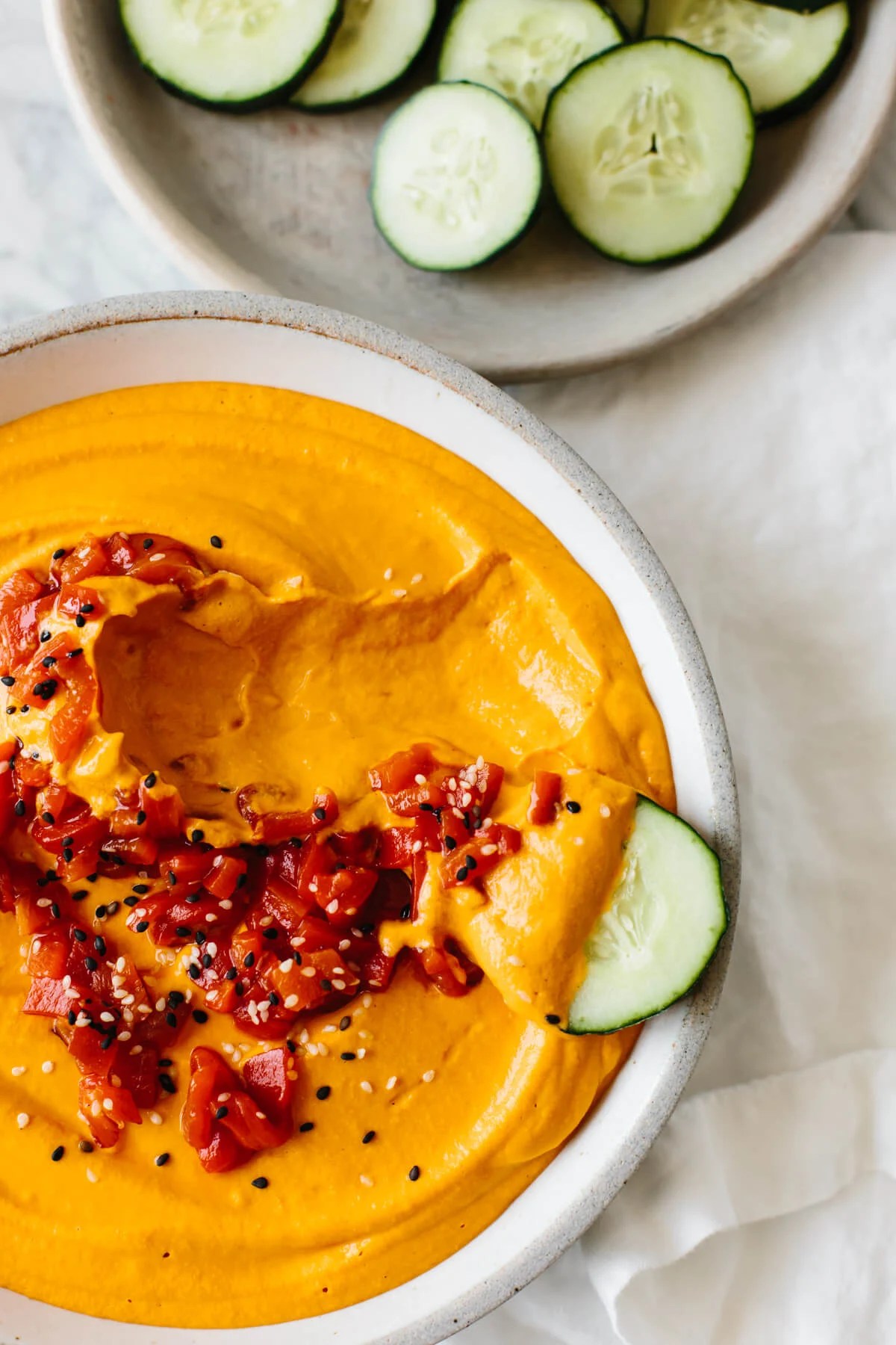 Roasted red pepper hummus is incredibly easy to make at home with just a few ingredients. It's creamy, smooth, slightly smoky and full of flavor - a great healthy snack recipe!