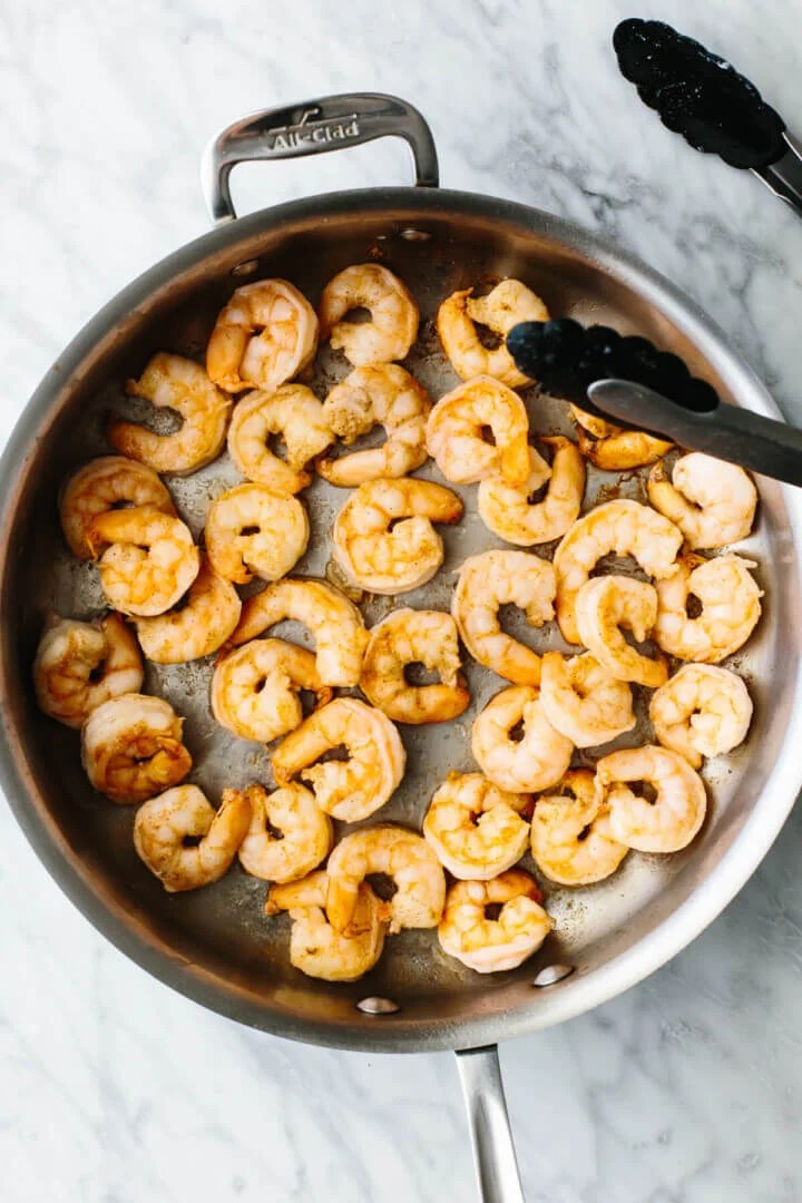 Cooking shrimp in a pan for shrimp fried rice